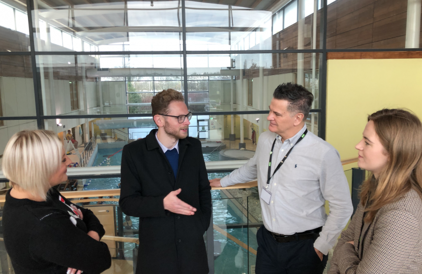 Group talks with swimming pool backdrop