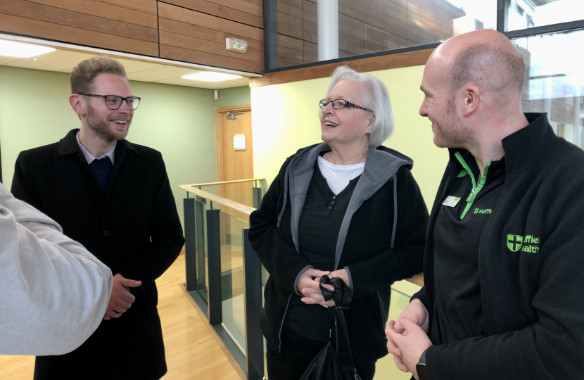 Jack speaks with a participant of the joint pain programme