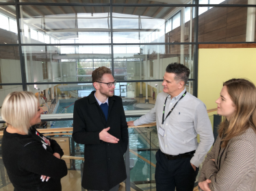 Group talks with swimming pool backdrop