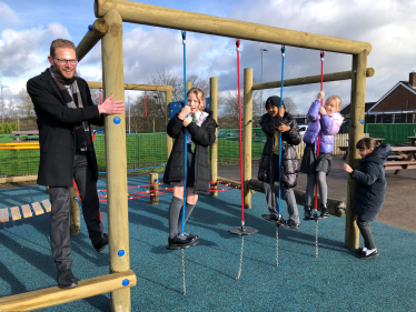 Jack climbs the play frame